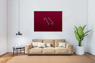 Πίνακας, ένα ζαχαροκάλαμο που απλώνεται πάνω σε μια κόκκινη επιφάνεια