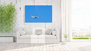 Πίνακας, ένα μικρό αεροπλάνο που πετά μέσα από έναν γαλάζιο ουρανό
