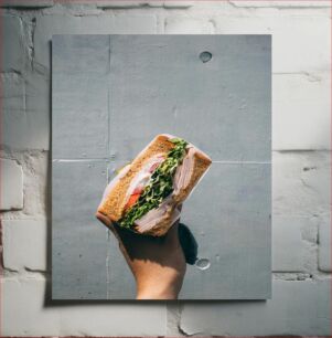 Πίνακας, Hand Holding a Fresh Sandwich Χέρι που κρατά ένα φρέσκο ​​σάντουιτς