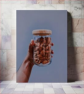Πίνακας, Hand Holding a Jar of Almonds Χέρι που κρατά ένα βάζο με αμύγδαλα