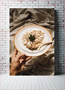 Πίνακας, Hand holding cereal bowl with yogurt Χέρι που κρατά ένα μπολ δημητριακών με γιαούρτι