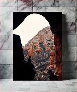 Πίνακας, Silhouette in a Cave Overlooking a Rocky Landscape Σιλουέτα σε μια σπηλιά με θέα σε βραχώδες τοπίο